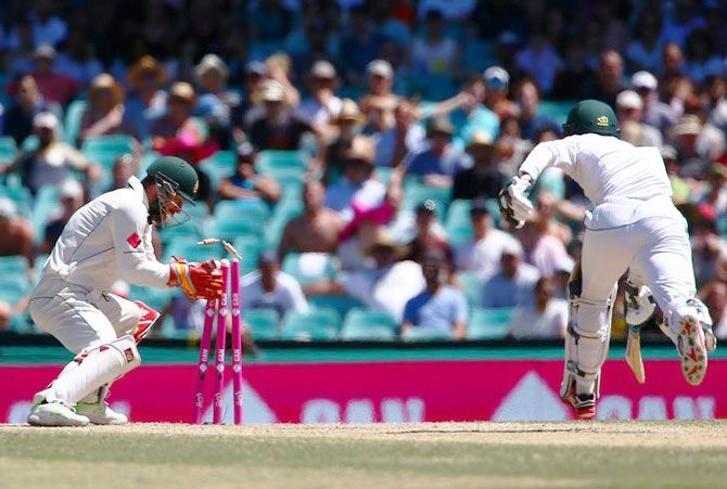Australia's wicket-keeper Matthew Wade runs out Pakistan's Mohammad Amir