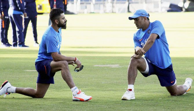 VirVirat Kohli and Mahendra Singh Dhoni during a practice session in Pune on Wednesday
