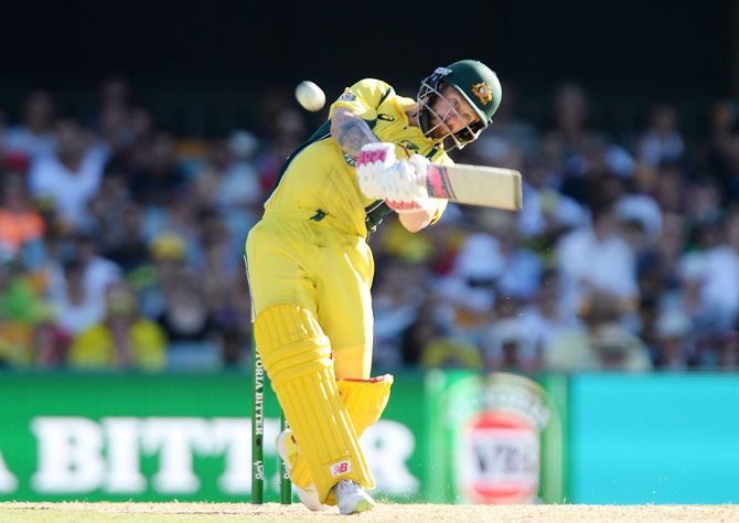 Australia's Matthew Wade hits the ball over the boundary for a six during the first game of the One Day International series against Pakistan at The Gabba in Brisbane on Friday