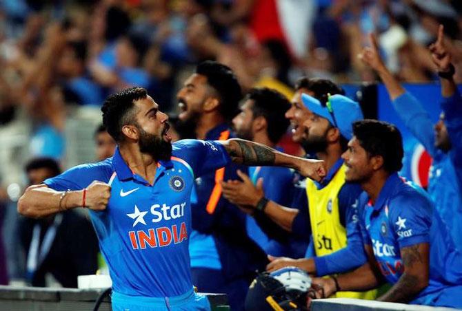 India's captain Virat Kohli celebrates after winning the first ODI against England at the Maharashtra Cricket Association Stadium in Pune on Sunday