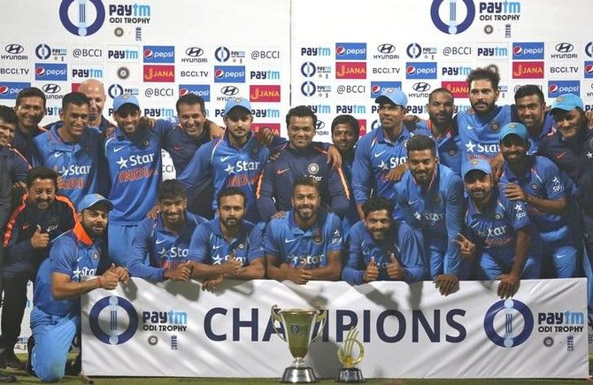 The Indian cricket team poses with the trophy on Sunday after claiming the 3-match series 2-1
