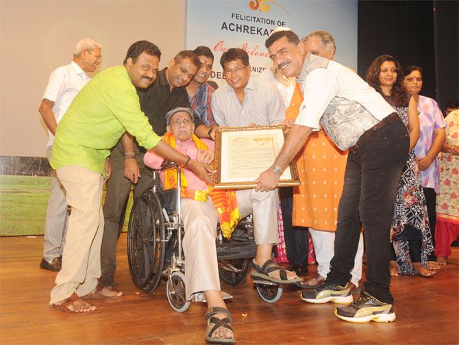 Former India and Mumbai cricketers Pravin Amre and Chandrakant Pandit among others felicitate coach par excellence Ramakant Archrekar at a function to mark 'Guru Purnima' on in Mumbai on Sunday