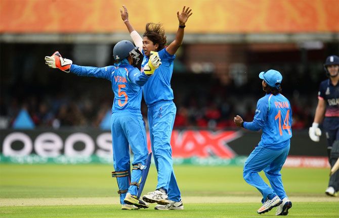 India's Jhulan Goswami and keeper Sushma Verma celebrate after picking an England wicket during their ICC Women's World Cup final at Lord's in London on Sunday