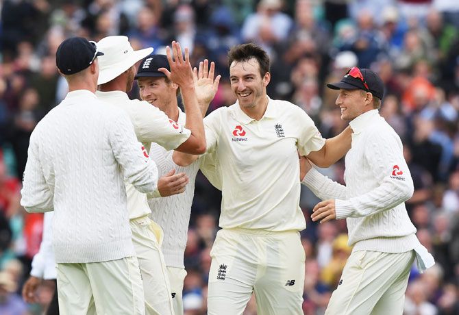 England's Toby Roland-Jones celebrates after taking his fourth wicket on Day 2 of the 3rd Investec Test against South Africa at The Kia Oval in London on Friday