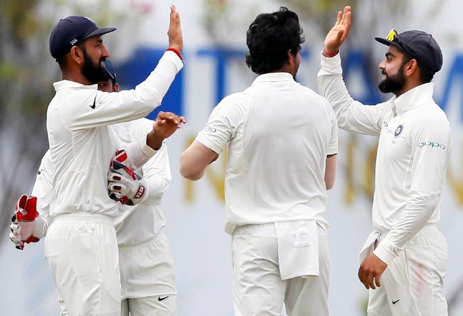  India's players celebrate the wicket of Danushka Gunathilaka