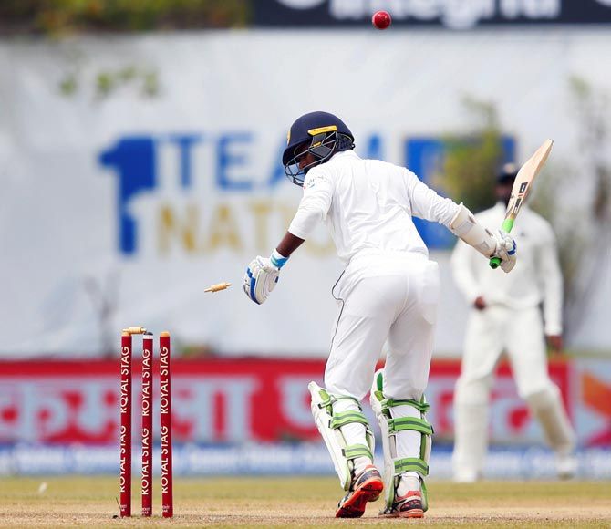 Sri Lanka's Upul Tharanga is bowled by India's Mohammed Shami
