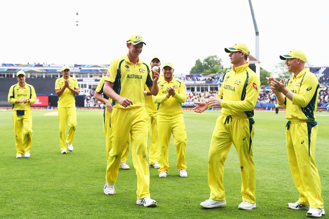 Josh Hazlewood (left) is applauded by team mates after finishing with match figures of 6 for 52
