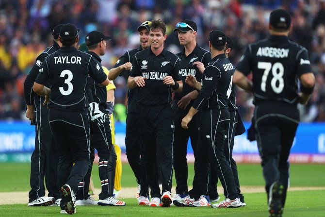 New Zealand's Adam Milne (centre) celebrates taking the wicket of Australia's Moises Henriques during the ICC Champions Trophy Group A match at Edgbaston in Birmingham on Friday