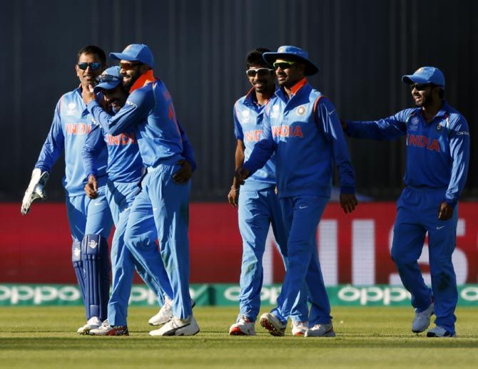 India's players celebrate the wicket of Shoaib Malik