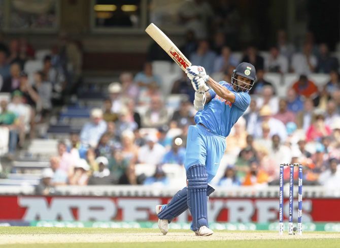 India's Shikhar Dhawan plays the pull shot during the Champions Trophy Group B match against South Africa at the Oval in London on Sunday