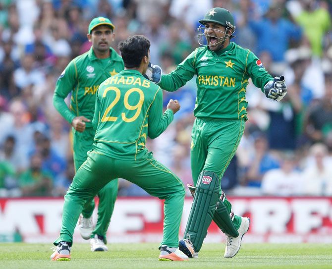  Pakistan captain Sarfraz Ahmed celebrates with Shadab Khan after claiming a wicket
