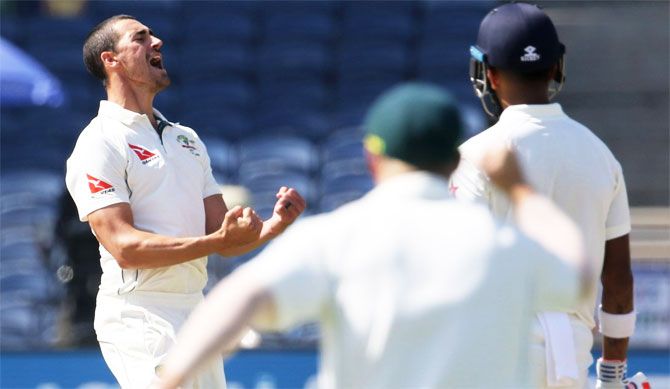 Mitchell Starc celebrates a wicket in the 1st Test in Pune
