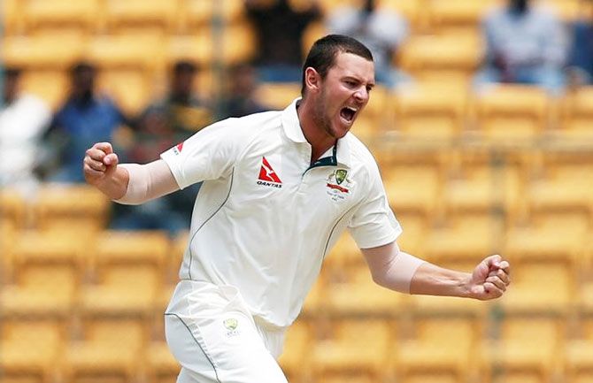 Australia's Josh Hazlewood celebrates the wicket of India's Abhinav Mukund