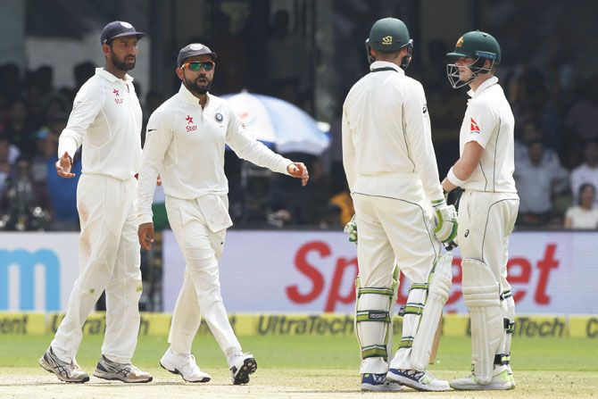 India captain Virat Kohli exchanges a few words as Steve Smith asks for the DRS during the Bengaluru Test in March last year. Australia skipper Smith was slammed for taking dressing room assistance over DRS referrals