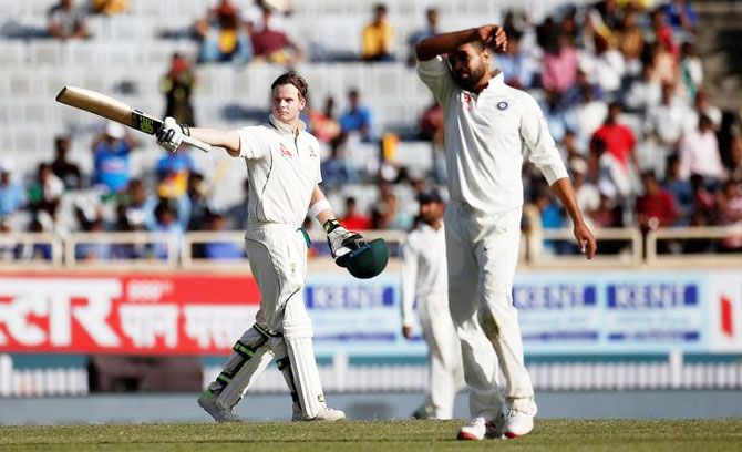 Australia's Steven Smith (left) celebrates his century against India on Thursday