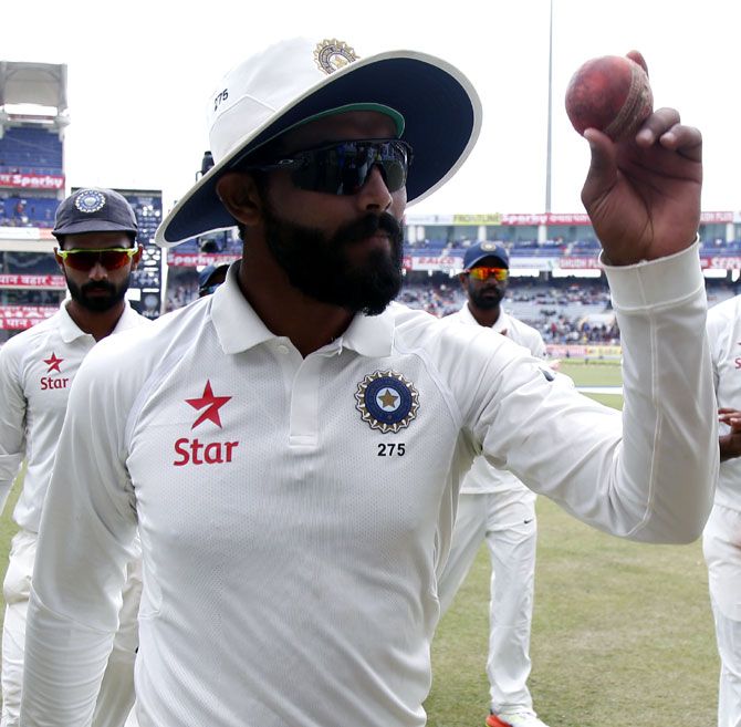 Ravindra Jadeja celebrates picking up five wickets after the end of Australia's first innings