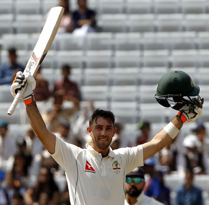  Glenn Maxwell celebrates after completing his maiden Test century on Friday