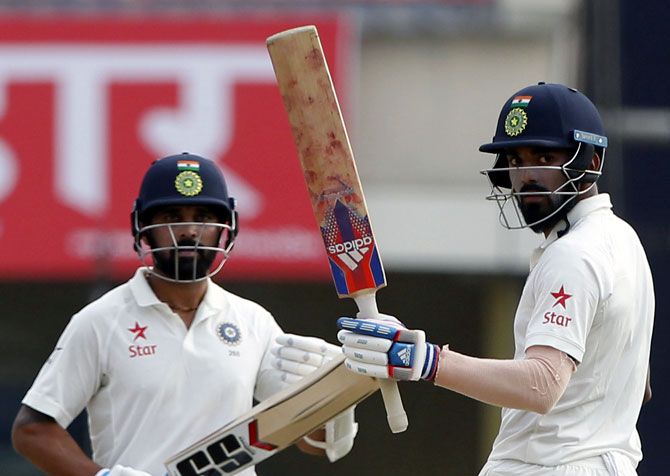 KL Rahul, right, raises his bat to the crowd after completing his half-century against Australia on Day 2 of the 3rd Test in Ranchi on Friday