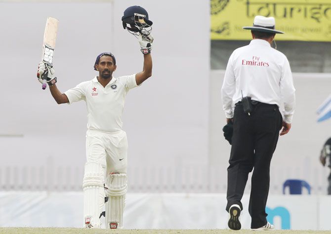 Wriddhiman Saha acknowledges the crowd after completing his century