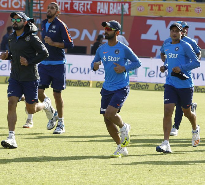 Virat Kohli and Ajinkya Rahane lead the warm-up before the start of play on Day 1 of the 4th Test in Dharamsala on Saturday