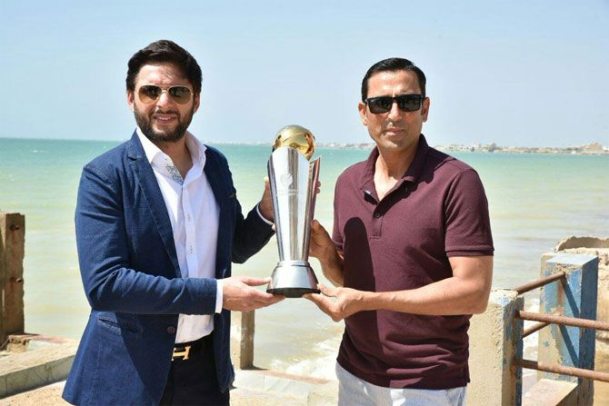 Pakistan cricketers Shahid Afridi and Misbah-ul-Haq at the unveiling of the Champions Trophy in Karachi on Thursday