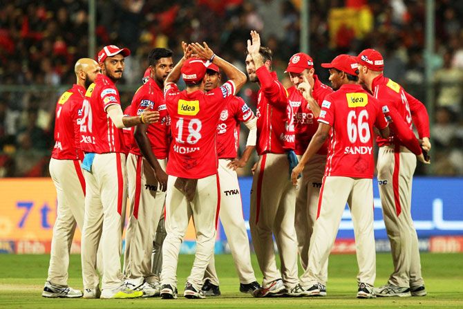 Punjab captain Glenn Maxwell celebrates a wicket with teammates during their IPL match in Bengaluru on Friday