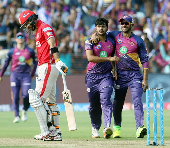 Rising Pune Supergiant's Shardul Thakur celebrates with Manoj Tiwary after taking the wicket of Glenn Maxwell