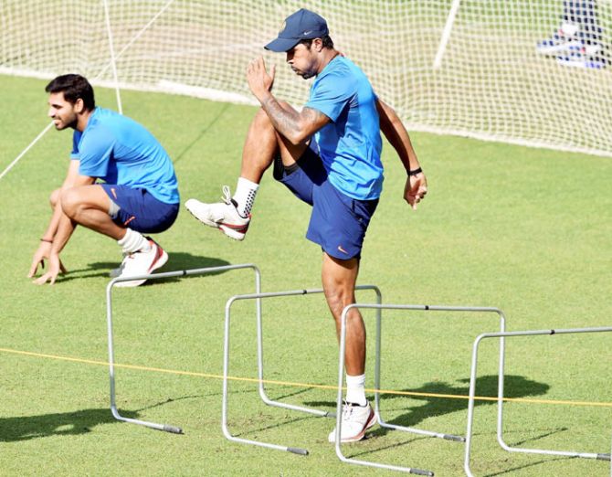 Indian pacers B Kumar and Umesh Yadav get into the groove during a training session at Eden Garden in Kolkata on Monday