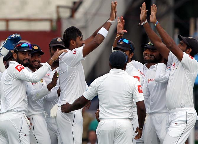 Sri Lanka's players celebrate the wicket of Shikhar Dhawan