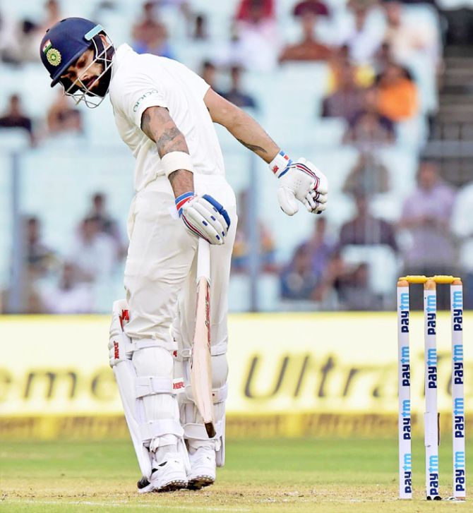 India cricket captain Virat Kohli reacts after his dismissal during the first day of the 1st cricket test match against Sri Lanka at Eden Gardens in Kolkata on Thursday