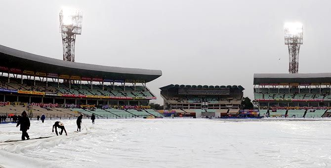 The Eden Gardens outfield and pitch under covers