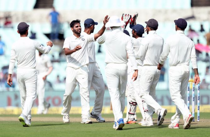 Bhuvneshwar Kumar celebrates the fall of a wicket 