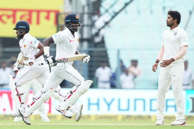 Sri Lanka's Angelo Mathews and Lahiru Thirimanne run between the wickets during Day 3 of the 1st Test match between India and Sri Lanka at Eden Gardens in Kolkata on Saturday
