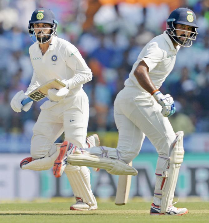 Indian batsmen Murli Vijay and Cheteshwar Pujara running between the wickets during Day 2 of the 2nd Test against Sri Lanka in Nagpur on Saturday