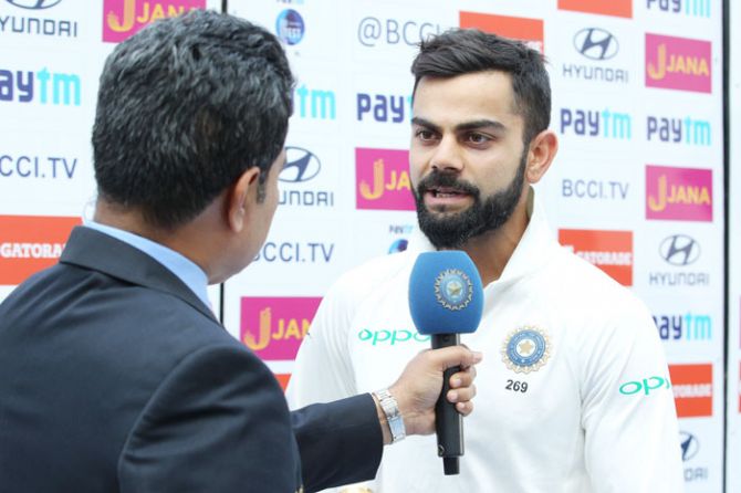 Virat Kohli speaks during the post-match presentation ceremony on Monday