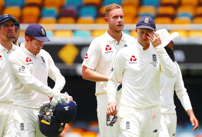 England players walk off the field after losing the opening Ashes Test at the Gabba in Brisbane on Monday