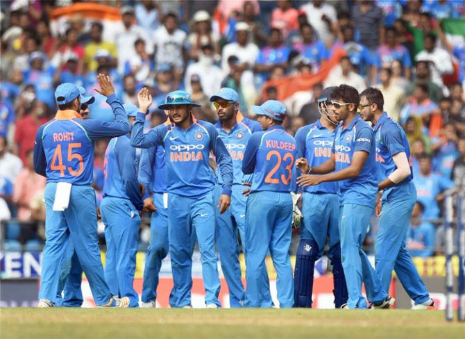 Indian bowler Axar Patel celebrates with teammates after dismissing Australia's David Warner at the Vidarbha Cricket Association Stadium, Jamtha, Nagpur on Sunday