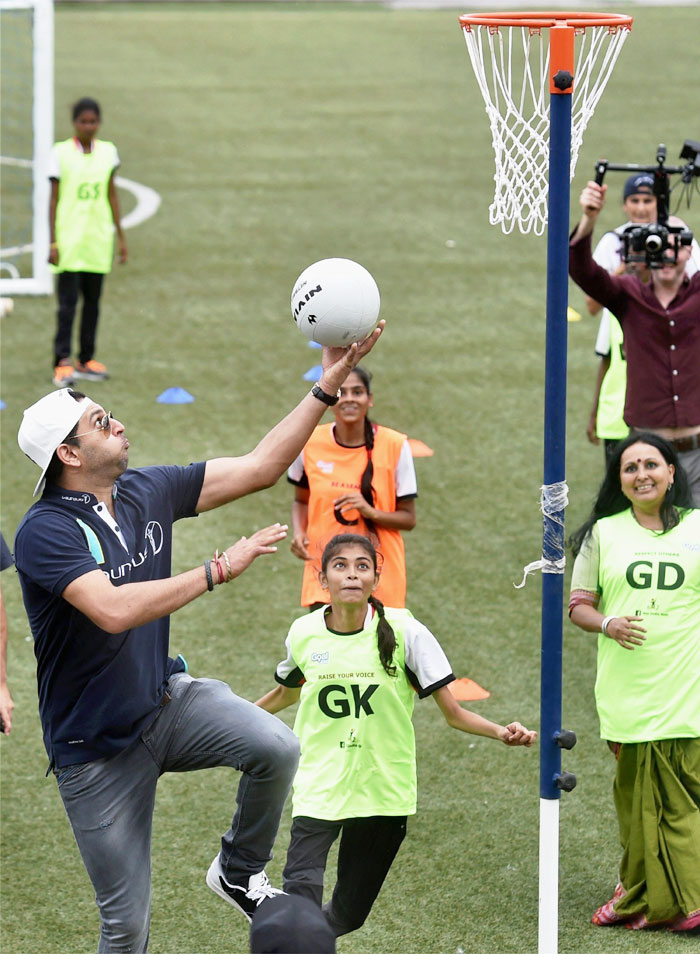 Cricketer Yuvraj Singh plays basketball with underpriviliged children during an event of Laureus and Mercedes-Benz India, in Mumbai on Wednesday