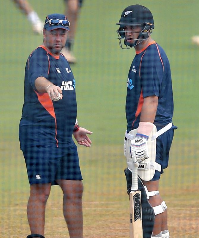 New Zealand player Ross Taylor (right) gets pointers from batting coach Craig McMillan during a practice session in Mumbai on Monday