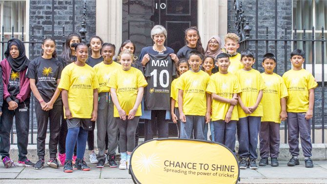 UK PM Theresa May poses with the children from charity group Chance to Shine