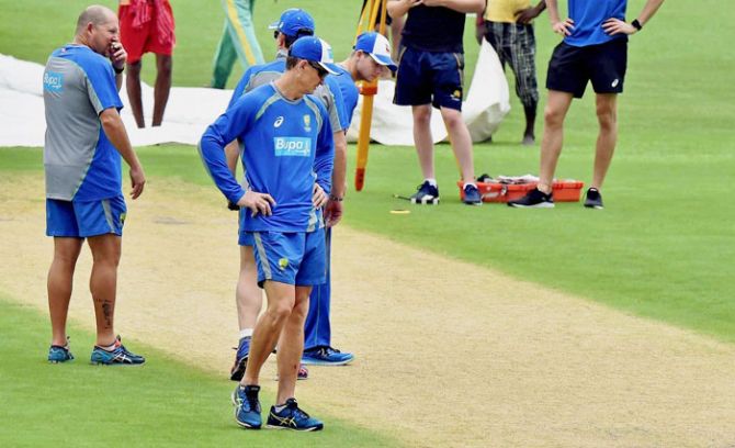 Australia captain Steve Smith and his teammates inspect the pitch at Eden Gardens in Kolkata on Wednesday