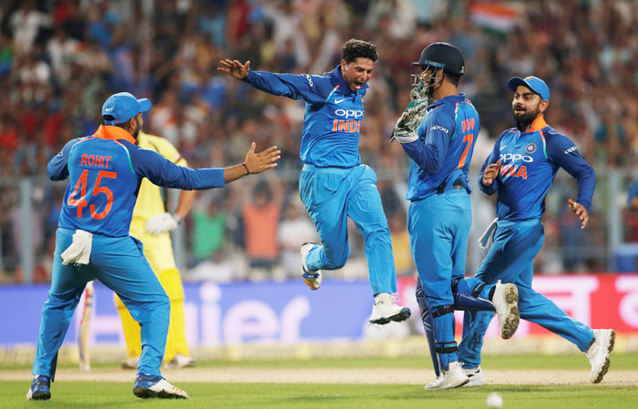 India's Kuldeep Yadav (2nd from left) celebrates with his teammates after dismissing Australia's Pat Cummins and register a hat-trick during the 2nd ODI at Eden Gardens in Kolkata on Thursday