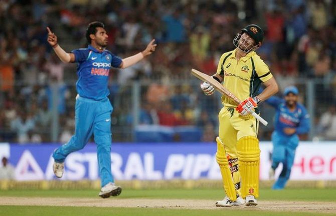 Bhuvneshwar Kumar celebrates after dismissing David Warner in the second ODI between India and Australia at the Eden Gardens on Thursday