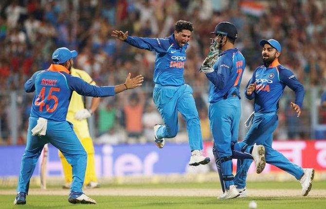 Kuldeep Yadav (centre) and spin-twin Yuzvendra Chahal, compliment each other well, reckons Rohit Sharma