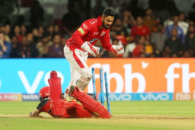 Kings XI Punjab's KL Rahul breaks the stumps to have Mandeep Singh run out