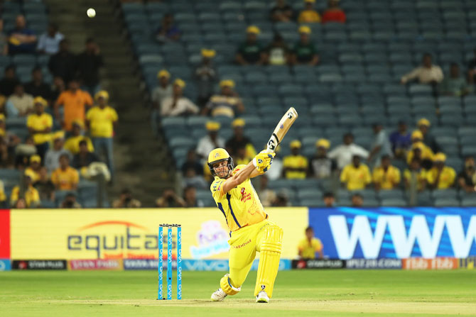 Shane Watson goes after the bowling