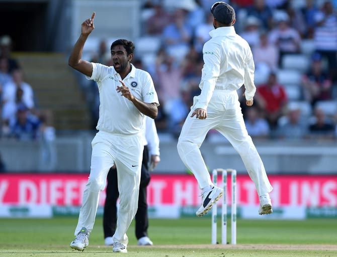 Ravichandran Ashwin, left, celebrates with Virat Kohli after dismissing Alastair Cook in the first innings