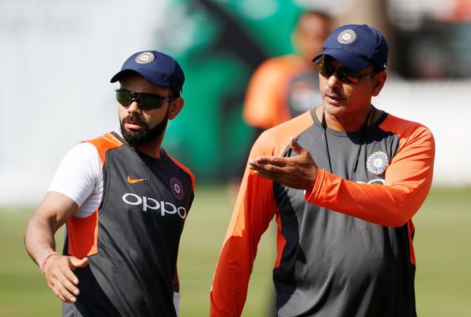 India head coach Ravi Shastri and Virat Kohli speak during a nets session on Tuesday