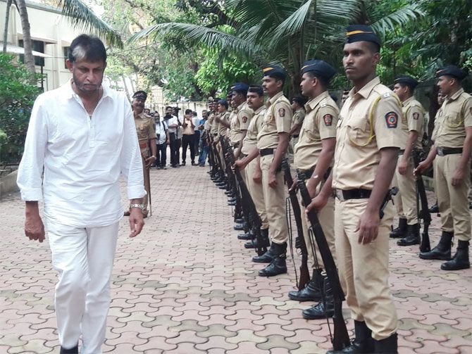 Former India cricketer Sandeep Patil arrives to pay his respects