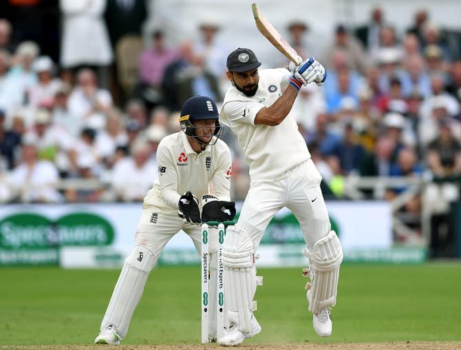 Virat Kohli on his way to his 23rd Test century. Photograph: Gareth Copley/Getty Images
